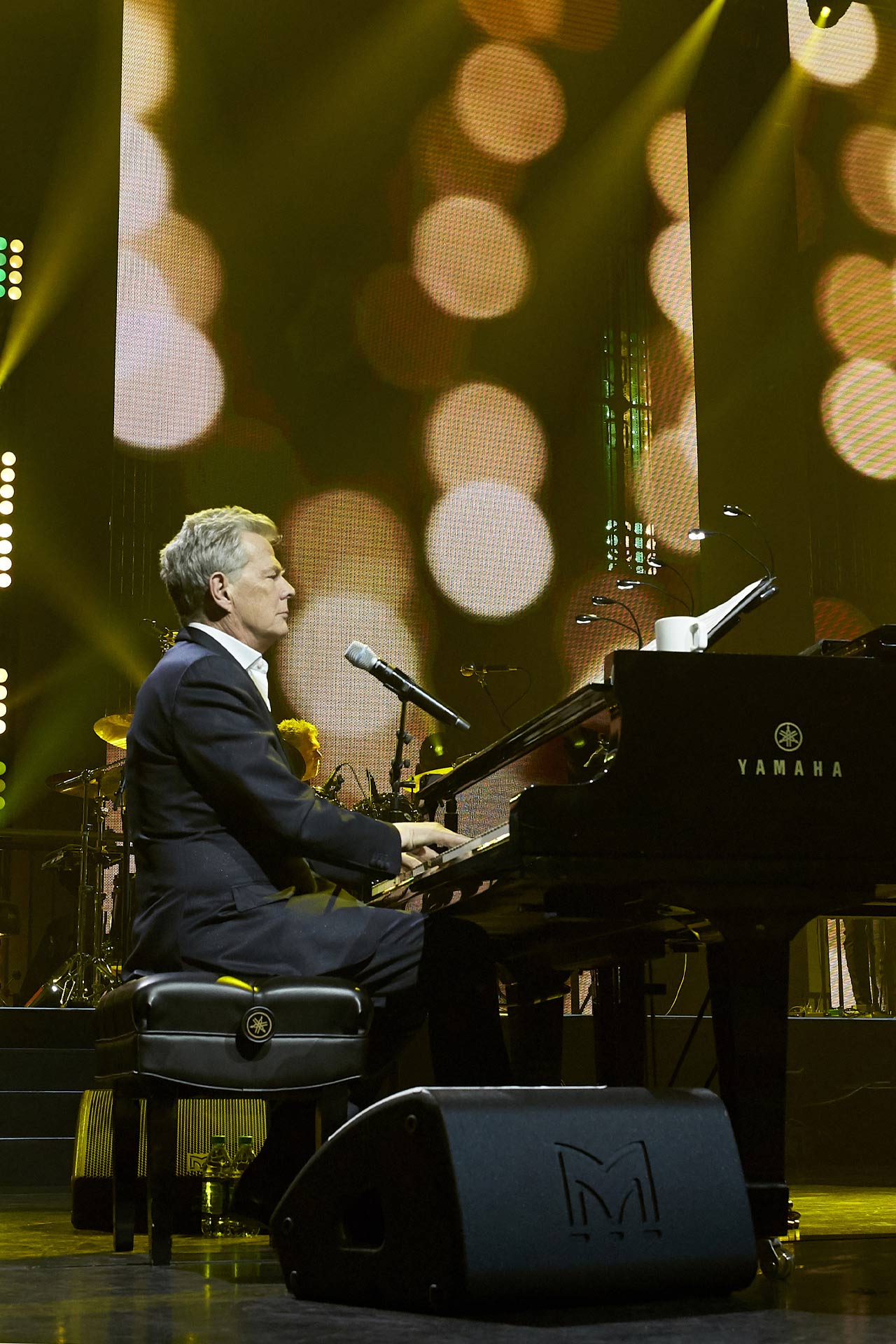 An XE500 stage monitor shown with David Foster at the closing concert for McDonald's 2018 Worldwide Convention